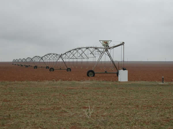 A long wheeled irrigation system in a field.